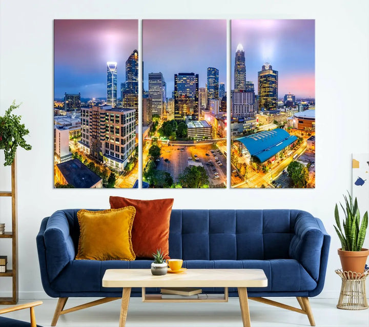 The "Charlotte City Lights Sunset Purple Skyline Cityscape View Wall Art Canvas Print" features a triptych of a vibrant city skyline at dusk, highlighting illuminated skyscrapers and urban streets. This artwork is crafted on museum-quality polycotton canvas, with its gallery-wrapped design ensuring durability and visual appeal for years to come.