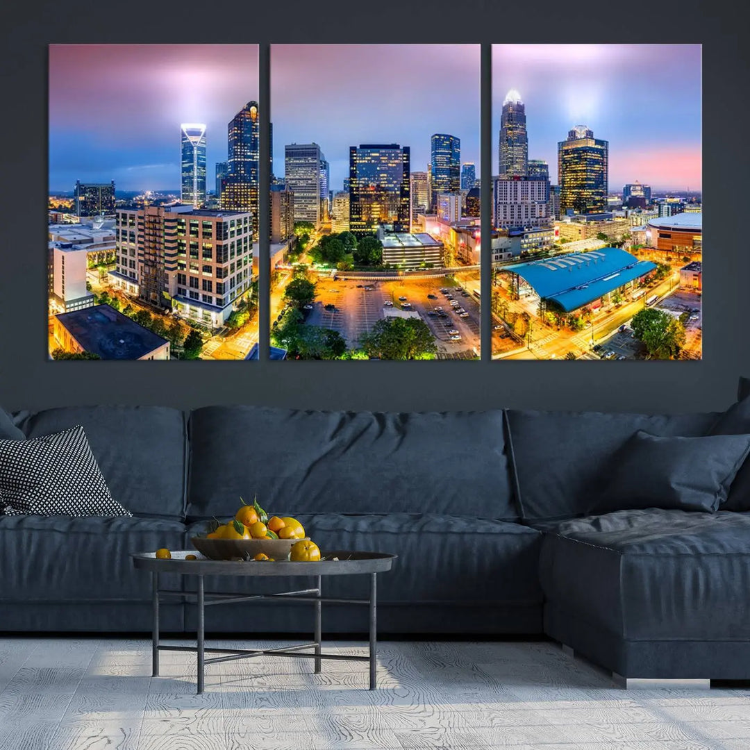 The "Charlotte City Lights Sunset Purple Skyline Cityscape View Wall Art Canvas Print" features a triptych of a vibrant city skyline at dusk, highlighting illuminated skyscrapers and urban streets. This artwork is crafted on museum-quality polycotton canvas, with its gallery-wrapped design ensuring durability and visual appeal for years to come.