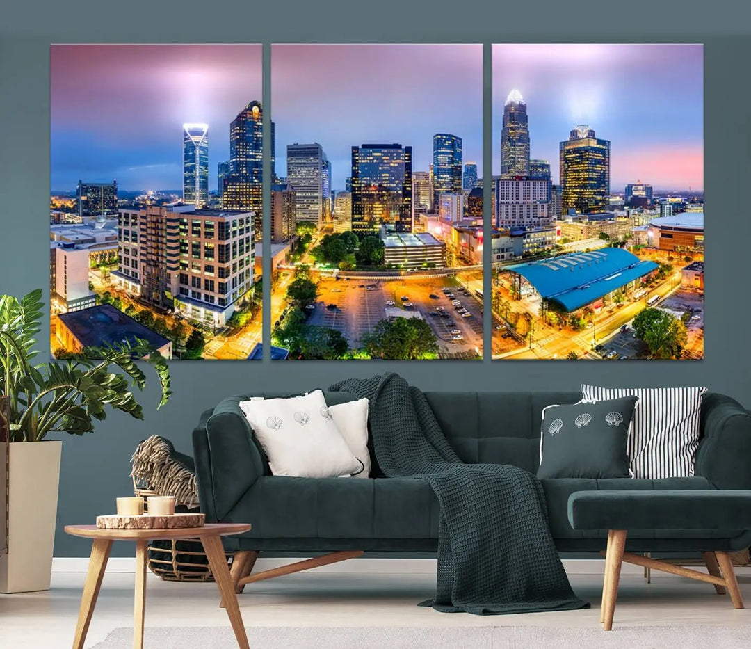 The "Charlotte City Lights Sunset Purple Skyline Cityscape View Wall Art Canvas Print" features a triptych of a vibrant city skyline at dusk, highlighting illuminated skyscrapers and urban streets. This artwork is crafted on museum-quality polycotton canvas, with its gallery-wrapped design ensuring durability and visual appeal for years to come.