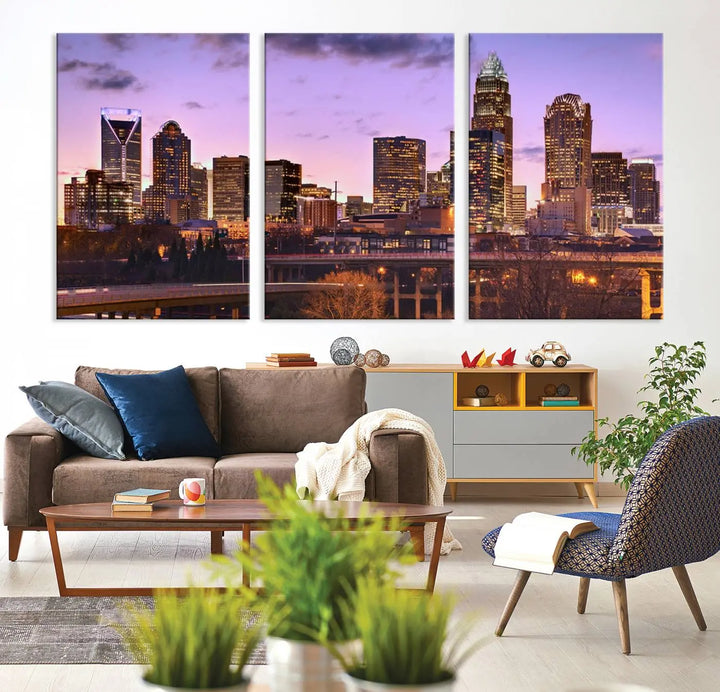 The "Charlotte City Lights Sunset Purple Skyline Cityscape View Wall Art Canvas Print" adorns the modern living room. This museum-quality piece is ready to hang and features a UV-protective coating to preserve its vibrant colors for years.