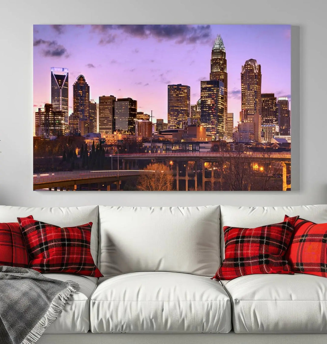 The "Charlotte City Lights Sunset Purple Skyline Cityscape View Wall Art Canvas Print" adorns the modern living room. This museum-quality piece is ready to hang and features a UV-protective coating to preserve its vibrant colors for years.