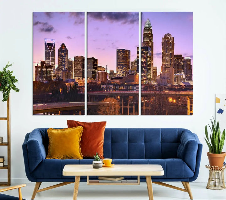 The "Charlotte City Lights Sunset Purple Skyline Cityscape View Wall Art Canvas Print" adorns the modern living room. This museum-quality piece is ready to hang and features a UV-protective coating to preserve its vibrant colors for years.