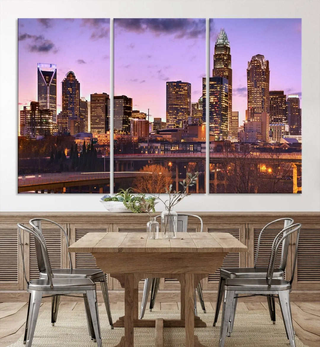 The "Charlotte City Lights Sunset Purple Skyline Cityscape View Wall Art Canvas Print" adorns the modern living room. This museum-quality piece is ready to hang and features a UV-protective coating to preserve its vibrant colors for years.