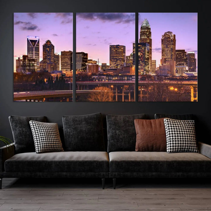 The "Charlotte City Lights Sunset Purple Skyline Cityscape View Wall Art Canvas Print" adorns the modern living room. This museum-quality piece is ready to hang and features a UV-protective coating to preserve its vibrant colors for years.