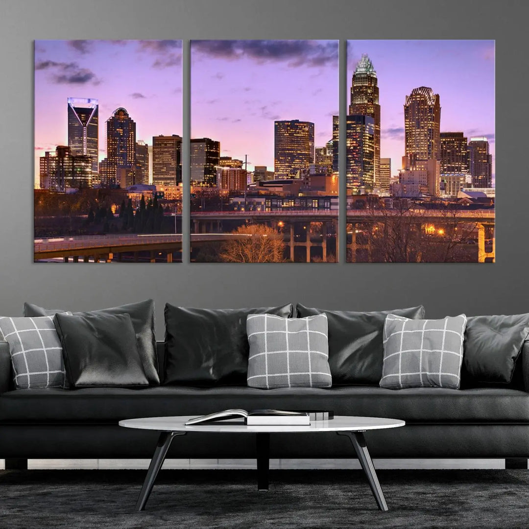 The "Charlotte City Lights Sunset Purple Skyline Cityscape View Wall Art Canvas Print" adorns the modern living room. This museum-quality piece is ready to hang and features a UV-protective coating to preserve its vibrant colors for years.