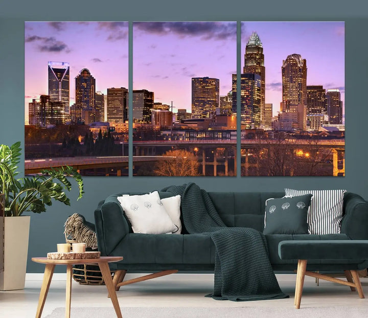 The "Charlotte City Lights Sunset Purple Skyline Cityscape View Wall Art Canvas Print" adorns the modern living room. This museum-quality piece is ready to hang and features a UV-protective coating to preserve its vibrant colors for years.