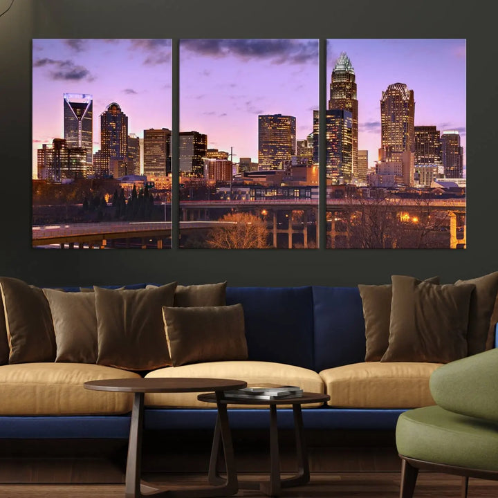 The "Charlotte City Lights Sunset Purple Skyline Cityscape View Wall Art Canvas Print" adorns the modern living room. This museum-quality piece is ready to hang and features a UV-protective coating to preserve its vibrant colors for years.