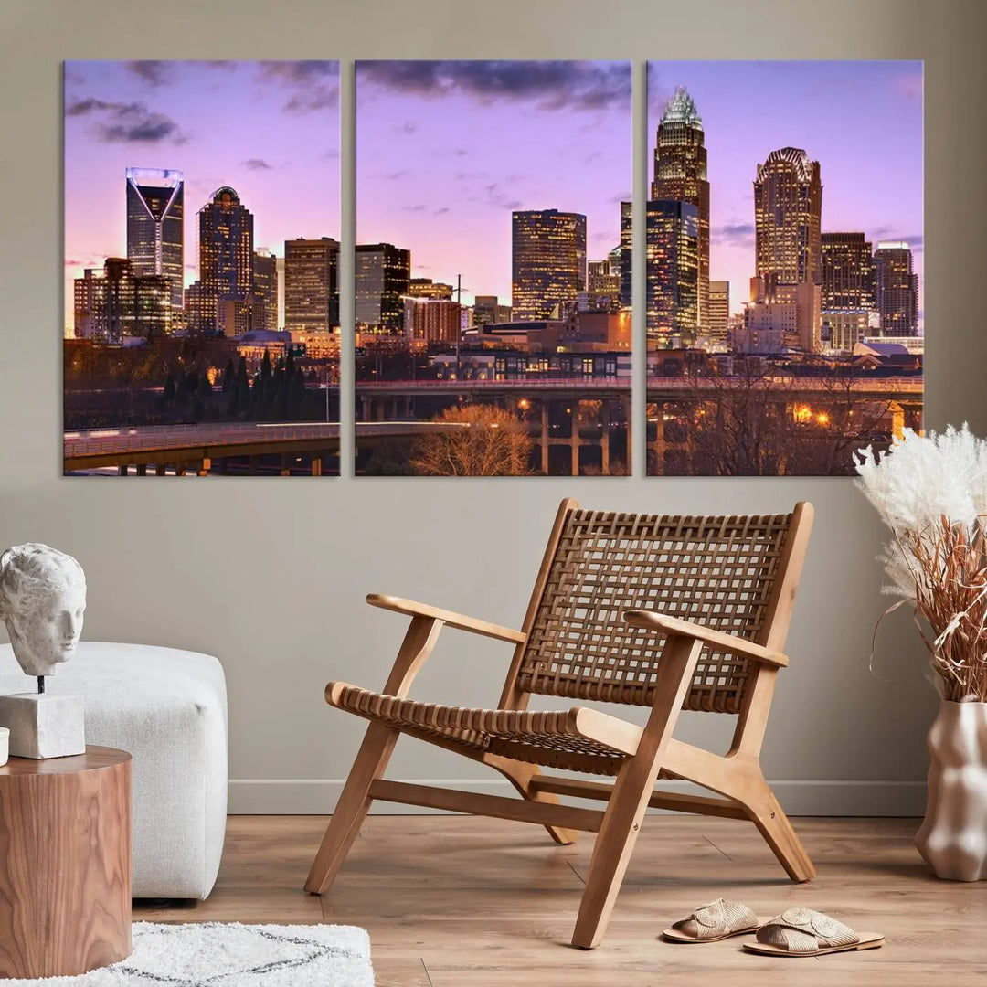 The "Charlotte City Lights Sunset Purple Skyline Cityscape View Wall Art Canvas Print" adorns the modern living room. This museum-quality piece is ready to hang and features a UV-protective coating to preserve its vibrant colors for years.