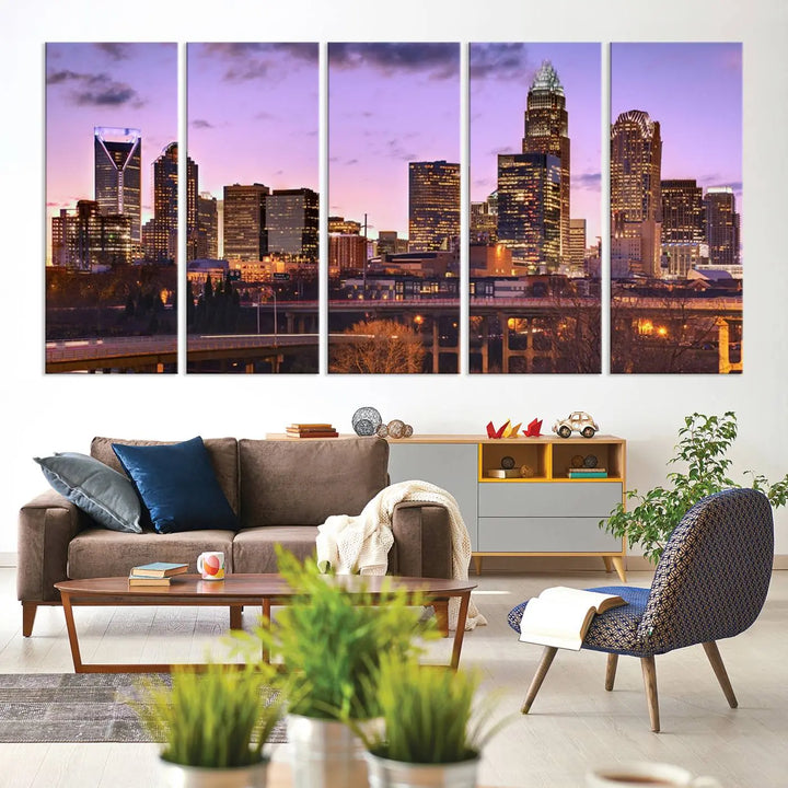 The "Charlotte City Lights Sunset Purple Skyline Cityscape View Wall Art Canvas Print" adorns the modern living room. This museum-quality piece is ready to hang and features a UV-protective coating to preserve its vibrant colors for years.