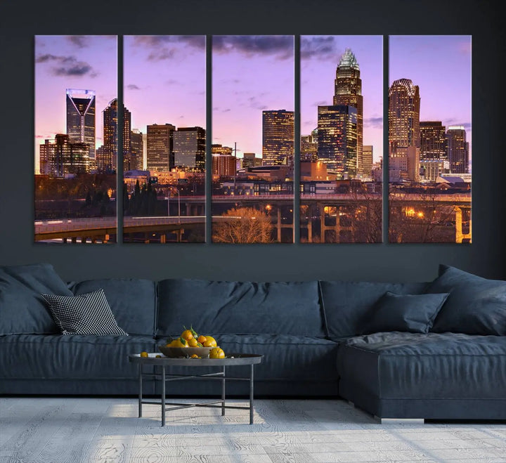 The "Charlotte City Lights Sunset Purple Skyline Cityscape View Wall Art Canvas Print" adorns the modern living room. This museum-quality piece is ready to hang and features a UV-protective coating to preserve its vibrant colors for years.