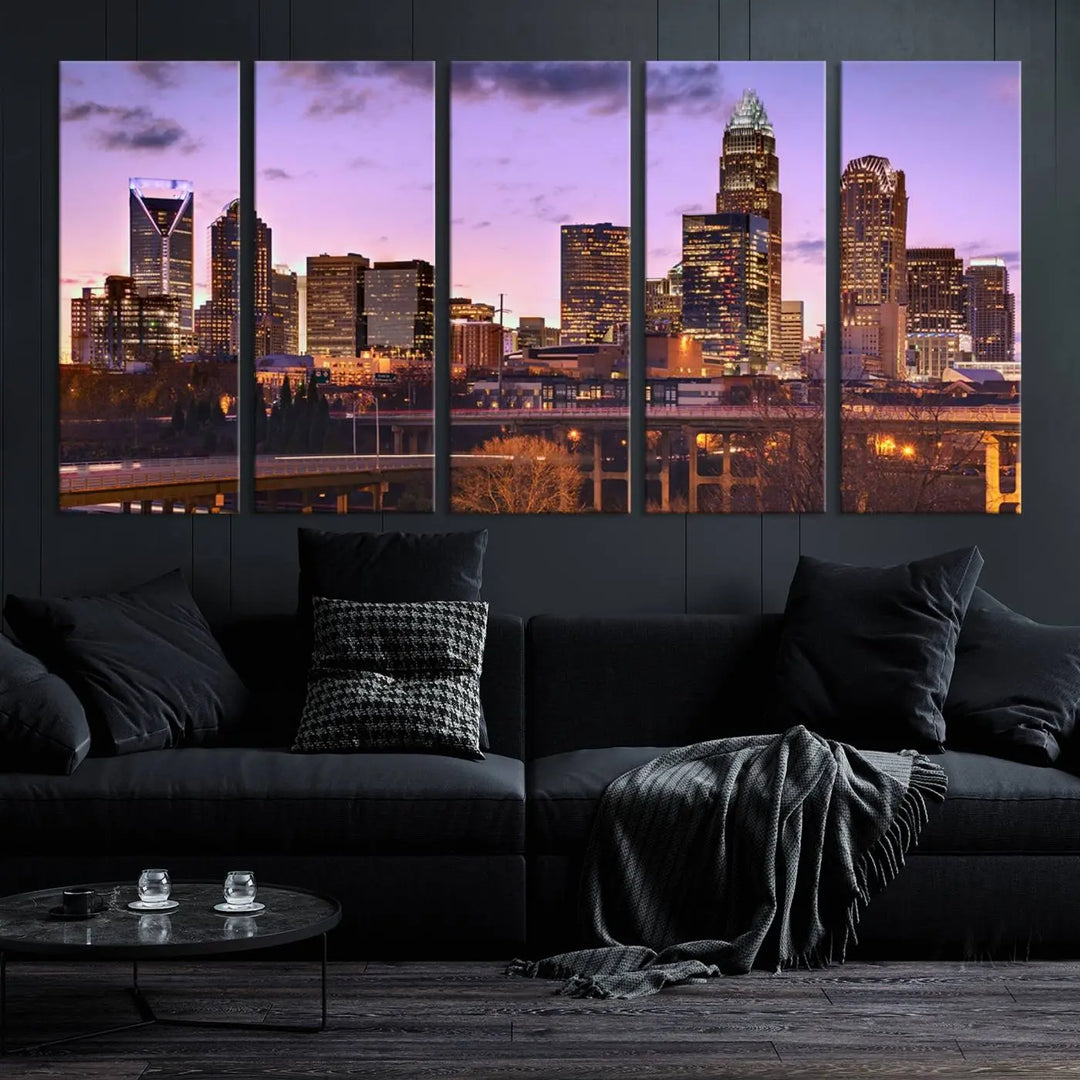 The "Charlotte City Lights Sunset Purple Skyline Cityscape View Wall Art Canvas Print" adorns the modern living room. This museum-quality piece is ready to hang and features a UV-protective coating to preserve its vibrant colors for years.