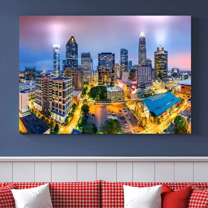 The living room features three large pieces of the *Charlotte City Lights Sunset Purple Skyline Cityscape View Wall Art Canvas Print*. Crafted on gallery-wrapped, museum-quality canvas with UV-protective coating, they grace the wall and add an artistic flair to the space.