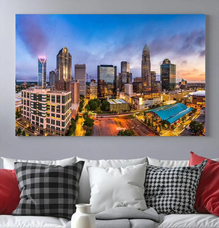 In the living room, a museum-quality, gallery-wrapped canvas titled "Charlotte City Lights Sunset Purple and Blue Skyline" showcases a stunning multi-panel cityscape. The artwork's UV-protective coating guarantees its brilliance for years to come.