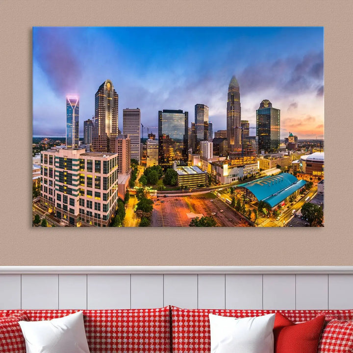 In the living room, a museum-quality, gallery-wrapped canvas titled "Charlotte City Lights Sunset Purple and Blue Skyline" showcases a stunning multi-panel cityscape. The artwork's UV-protective coating guarantees its brilliance for years to come.