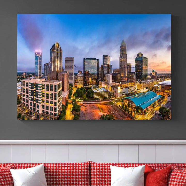 In the living room, a museum-quality, gallery-wrapped canvas titled "Charlotte City Lights Sunset Purple and Blue Skyline" showcases a stunning multi-panel cityscape. The artwork's UV-protective coating guarantees its brilliance for years to come.