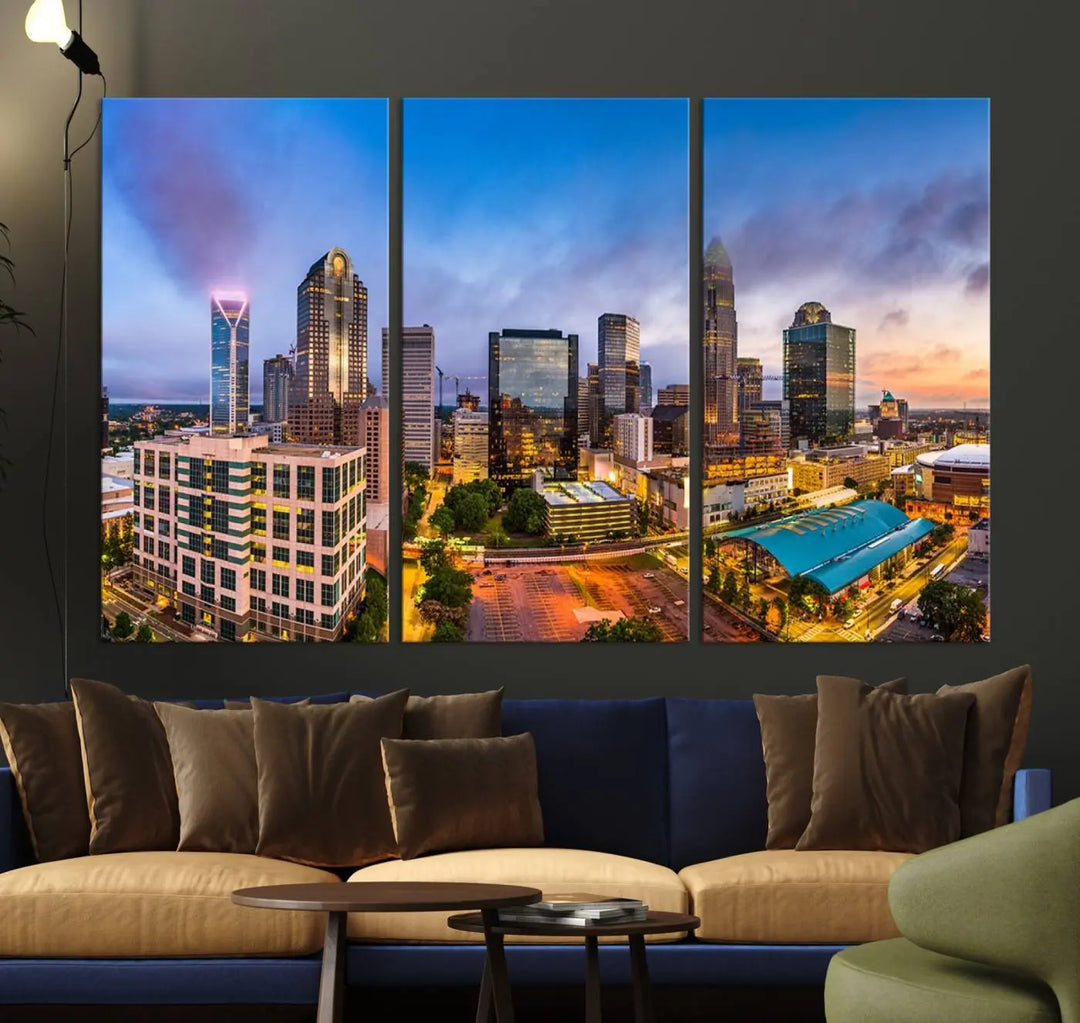 In the living room, a museum-quality, gallery-wrapped canvas titled "Charlotte City Lights Sunset Purple and Blue Skyline" showcases a stunning multi-panel cityscape. The artwork's UV-protective coating guarantees its brilliance for years to come.