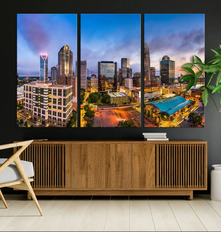 In the living room, a museum-quality, gallery-wrapped canvas titled "Charlotte City Lights Sunset Purple and Blue Skyline" showcases a stunning multi-panel cityscape. The artwork's UV-protective coating guarantees its brilliance for years to come.