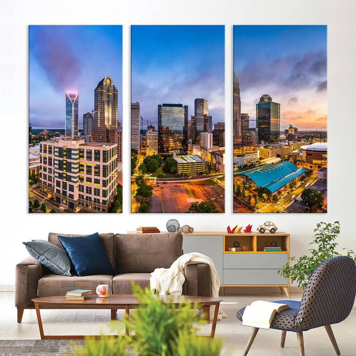 In the living room, a museum-quality, gallery-wrapped canvas titled "Charlotte City Lights Sunset Purple and Blue Skyline" showcases a stunning multi-panel cityscape. The artwork's UV-protective coating guarantees its brilliance for years to come.