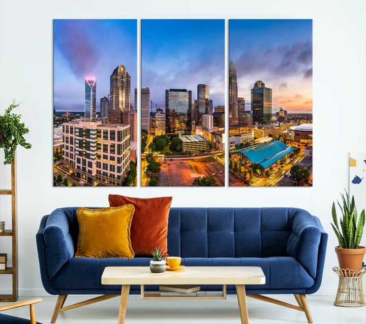 In the living room, a museum-quality, gallery-wrapped canvas titled "Charlotte City Lights Sunset Purple and Blue Skyline" showcases a stunning multi-panel cityscape. The artwork's UV-protective coating guarantees its brilliance for years to come.