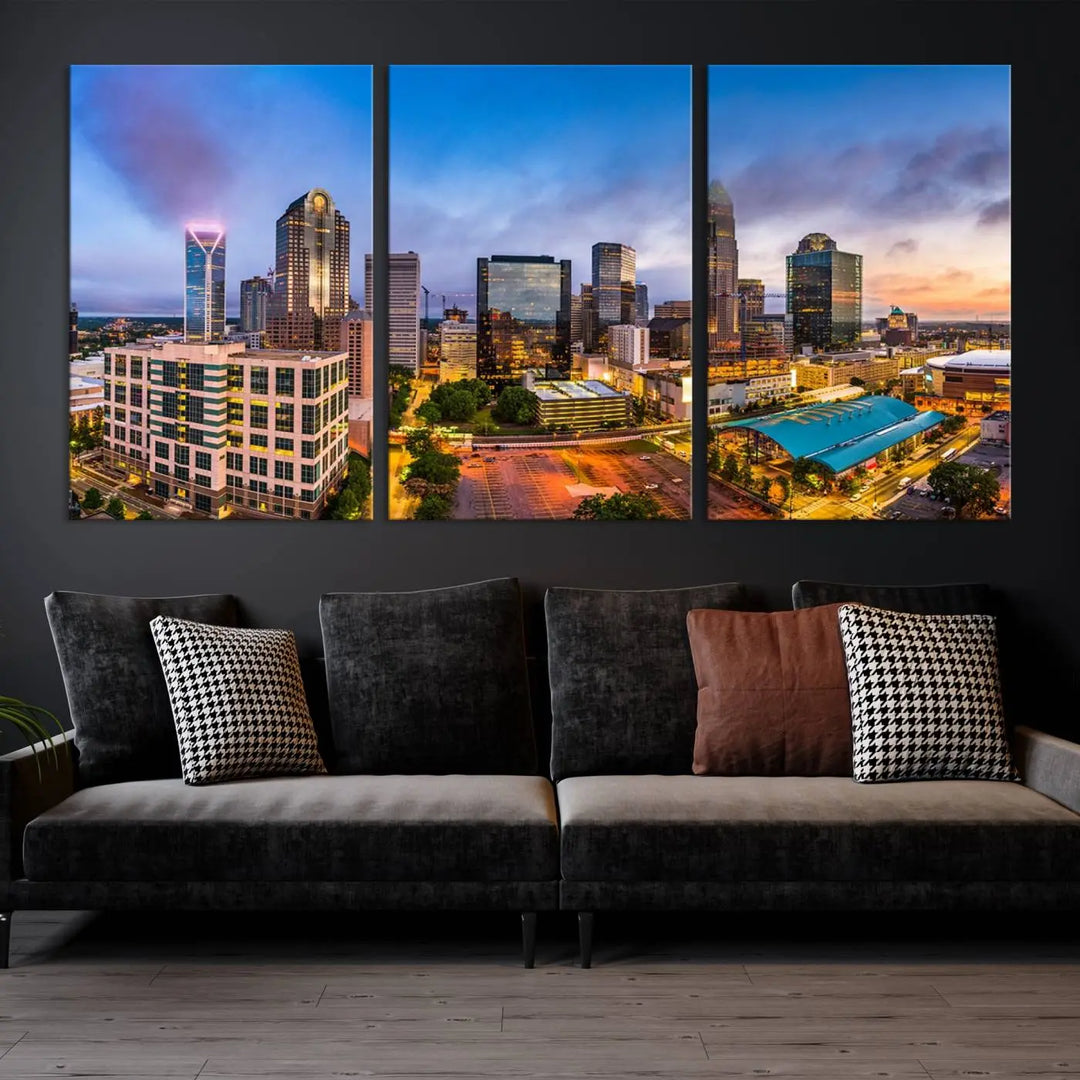 In the living room, a museum-quality, gallery-wrapped canvas titled "Charlotte City Lights Sunset Purple and Blue Skyline" showcases a stunning multi-panel cityscape. The artwork's UV-protective coating guarantees its brilliance for years to come.