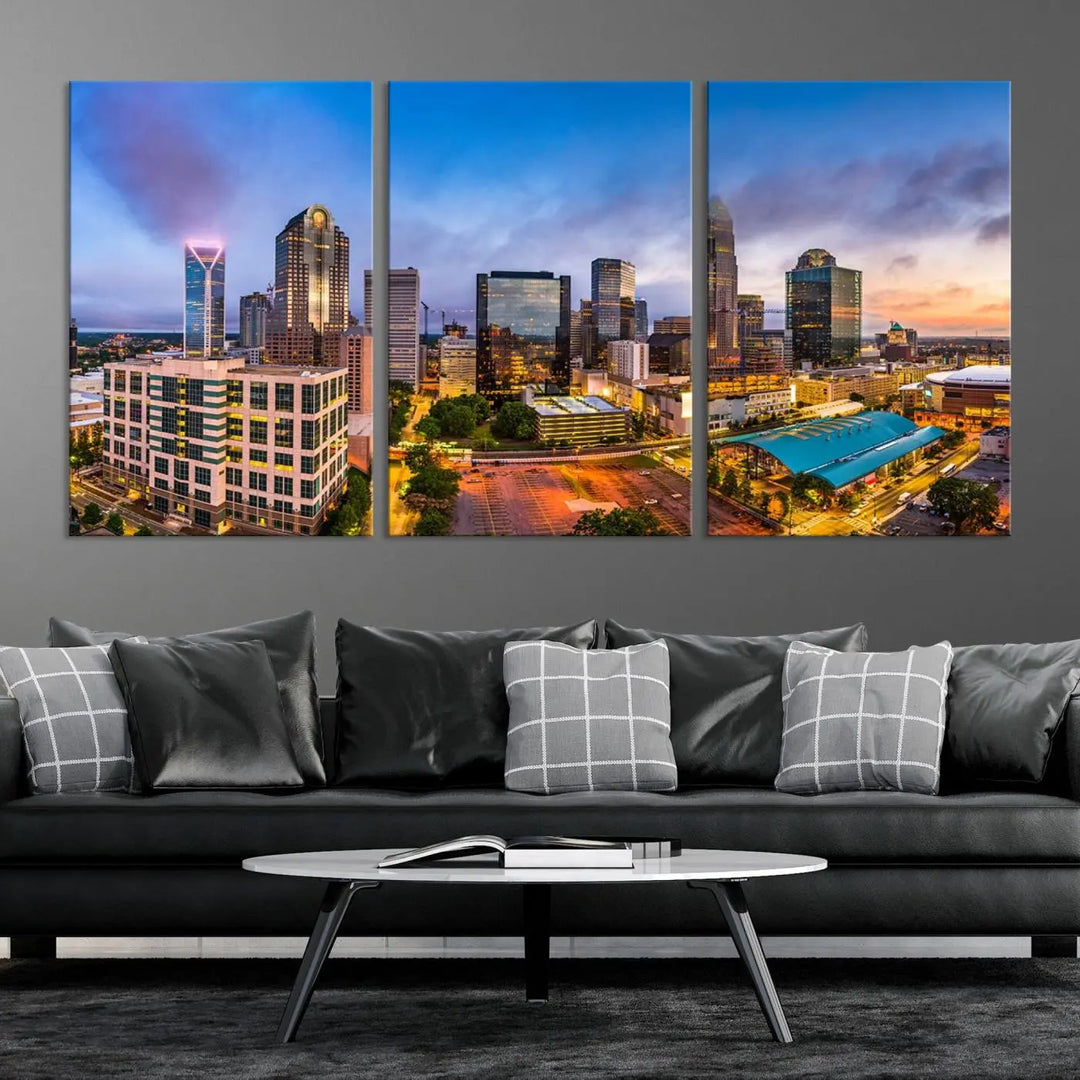 In the living room, a museum-quality, gallery-wrapped canvas titled "Charlotte City Lights Sunset Purple and Blue Skyline" showcases a stunning multi-panel cityscape. The artwork's UV-protective coating guarantees its brilliance for years to come.