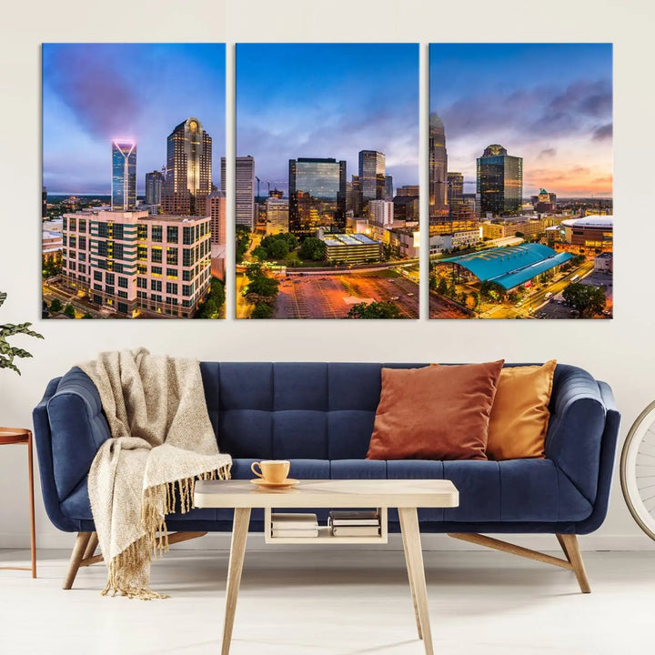 In the living room, a museum-quality, gallery-wrapped canvas titled "Charlotte City Lights Sunset Purple and Blue Skyline" showcases a stunning multi-panel cityscape. The artwork's UV-protective coating guarantees its brilliance for years to come.