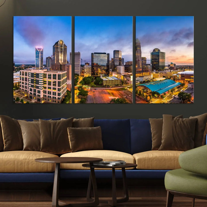 In the living room, a museum-quality, gallery-wrapped canvas titled "Charlotte City Lights Sunset Purple and Blue Skyline" showcases a stunning multi-panel cityscape. The artwork's UV-protective coating guarantees its brilliance for years to come.