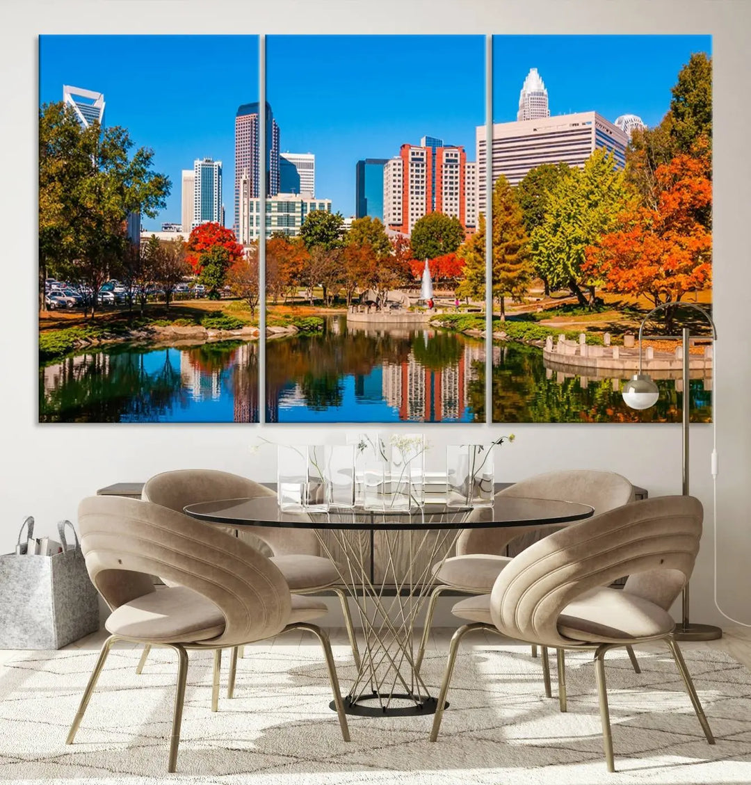 The Charlotte City Park at Fall Skyline Cityscape View wall art canvas print features a city panorama with a park and lake accented by autumn trees. It is mounted on museum-quality canvas with UV-protective coating and decorates the space.