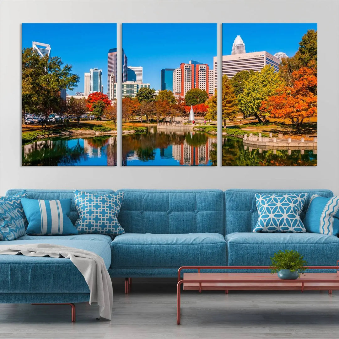 The Charlotte City Park at Fall Skyline Cityscape View wall art canvas print features a city panorama with a park and lake accented by autumn trees. It is mounted on museum-quality canvas with UV-protective coating and decorates the space.