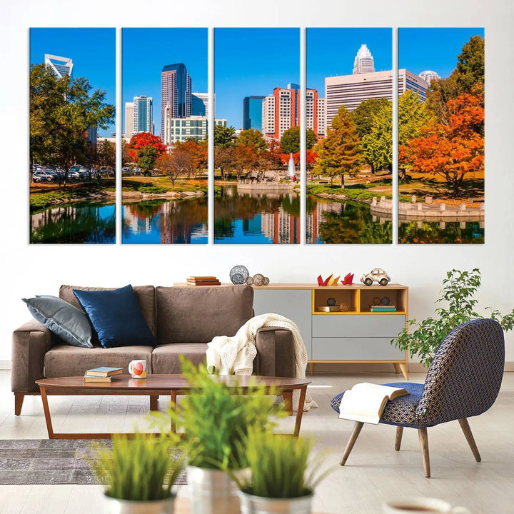 The Charlotte City Park at Fall Skyline Cityscape View wall art canvas print features a city panorama with a park and lake accented by autumn trees. It is mounted on museum-quality canvas with UV-protective coating and decorates the space.