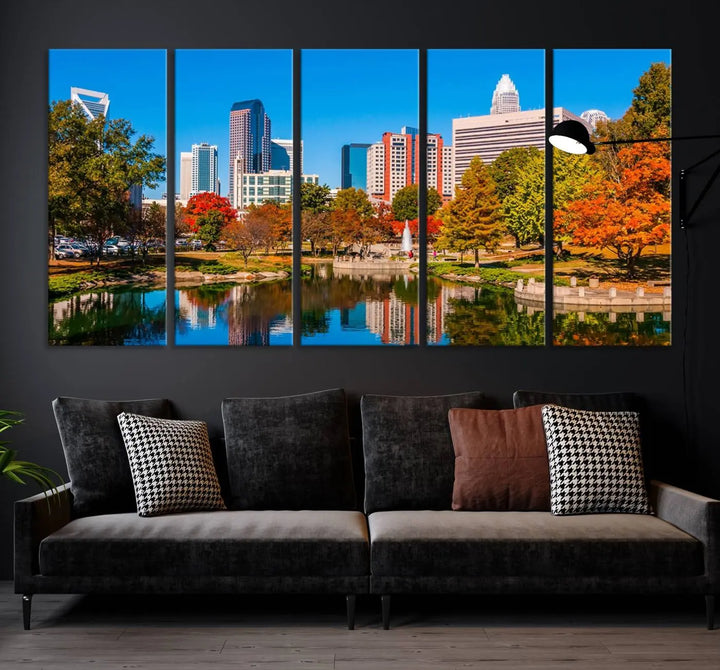 The Charlotte City Park at Fall Skyline Cityscape View wall art canvas print features a city panorama with a park and lake accented by autumn trees. It is mounted on museum-quality canvas with UV-protective coating and decorates the space.