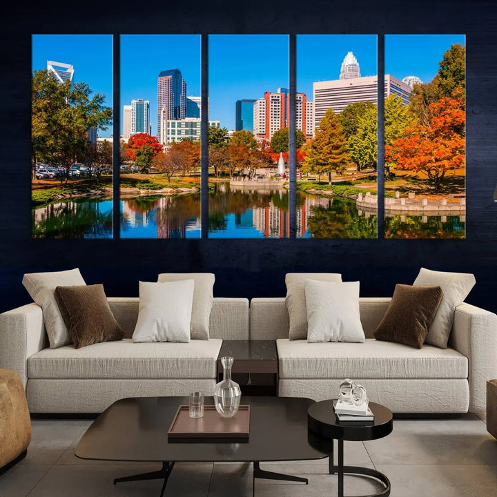 The Charlotte City Park at Fall Skyline Cityscape View wall art canvas print features a city panorama with a park and lake accented by autumn trees. It is mounted on museum-quality canvas with UV-protective coating and decorates the space.