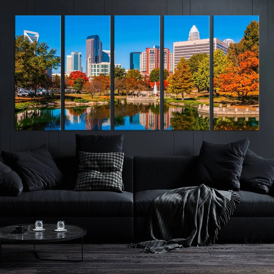 The Charlotte City Park at Fall Skyline Cityscape View wall art canvas print features a city panorama with a park and lake accented by autumn trees. It is mounted on museum-quality canvas with UV-protective coating and decorates the space.