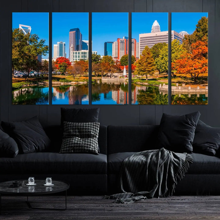 The Charlotte City Park at Fall Skyline Cityscape View wall art canvas print features a city panorama with a park and lake accented by autumn trees. It is mounted on museum-quality canvas with UV-protective coating and decorates the space.