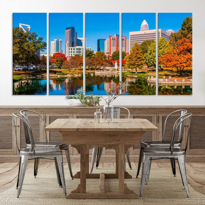 The Charlotte City Park at Fall Skyline Cityscape View wall art canvas print features a city panorama with a park and lake accented by autumn trees. It is mounted on museum-quality canvas with UV-protective coating and decorates the space.