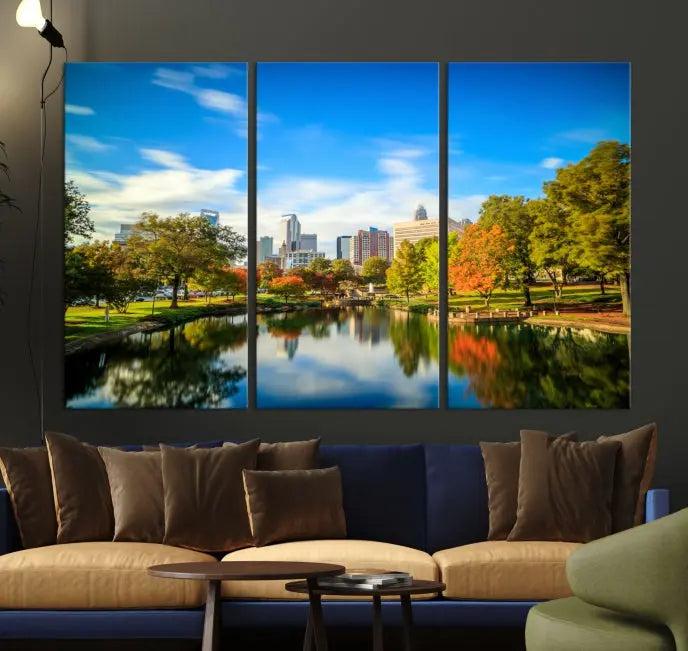 The Charlotte City Park at Spring Skyline Cityscape View Wall Art Canvas Print features a triptych of a city park scene with a calm lake, colorful autumn trees, and skyline. Crafted on museum-quality canvas and hand-assembled with a frame, this artwork is ready to hang and ideal for bringing elegance and serenity to your living space.