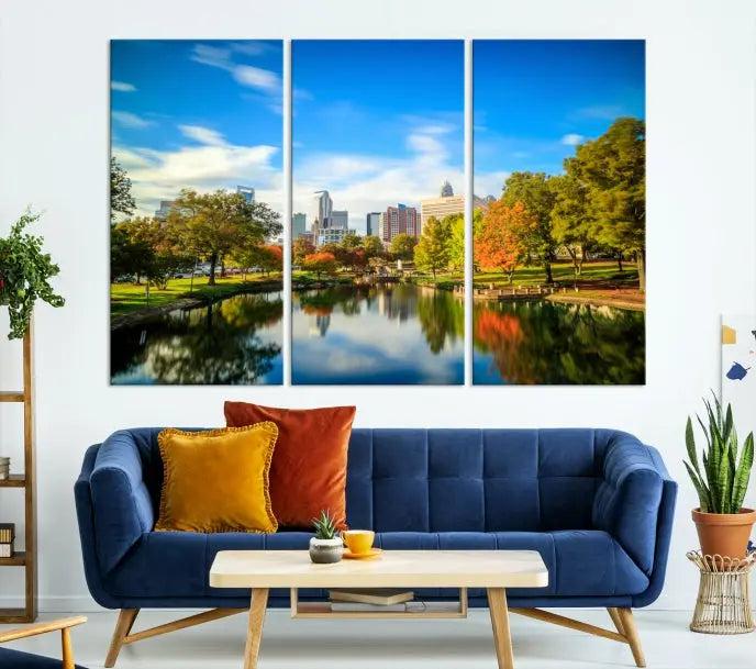 The Charlotte City Park at Spring Skyline Cityscape View Wall Art Canvas Print features a triptych of a city park scene with a calm lake, colorful autumn trees, and skyline. Crafted on museum-quality canvas and hand-assembled with a frame, this artwork is ready to hang and ideal for bringing elegance and serenity to your living space.