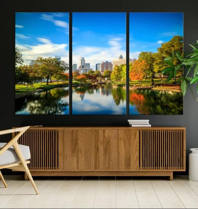 The Charlotte City Park at Spring Skyline Cityscape View Wall Art Canvas Print features a triptych of a city park scene with a calm lake, colorful autumn trees, and skyline. Crafted on museum-quality canvas and hand-assembled with a frame, this artwork is ready to hang and ideal for bringing elegance and serenity to your living space.