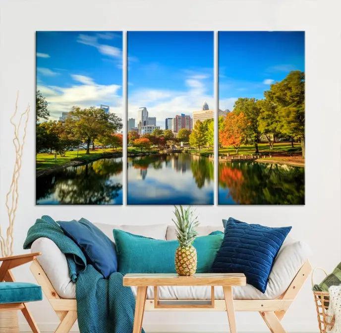 The Charlotte City Park at Spring Skyline Cityscape View Wall Art Canvas Print features a triptych of a city park scene with a calm lake, colorful autumn trees, and skyline. Crafted on museum-quality canvas and hand-assembled with a frame, this artwork is ready to hang and ideal for bringing elegance and serenity to your living space.