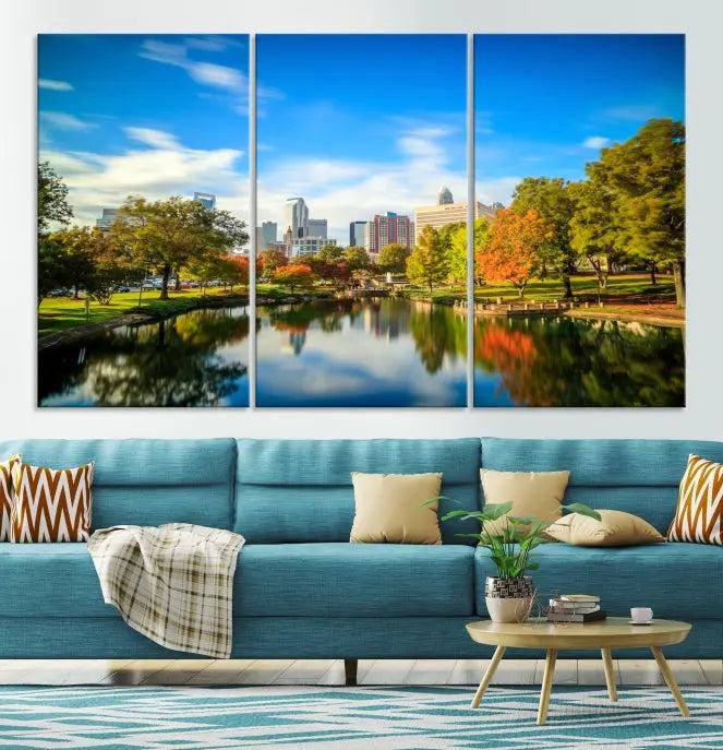 The Charlotte City Park at Spring Skyline Cityscape View Wall Art Canvas Print features a triptych of a city park scene with a calm lake, colorful autumn trees, and skyline. Crafted on museum-quality canvas and hand-assembled with a frame, this artwork is ready to hang and ideal for bringing elegance and serenity to your living space.