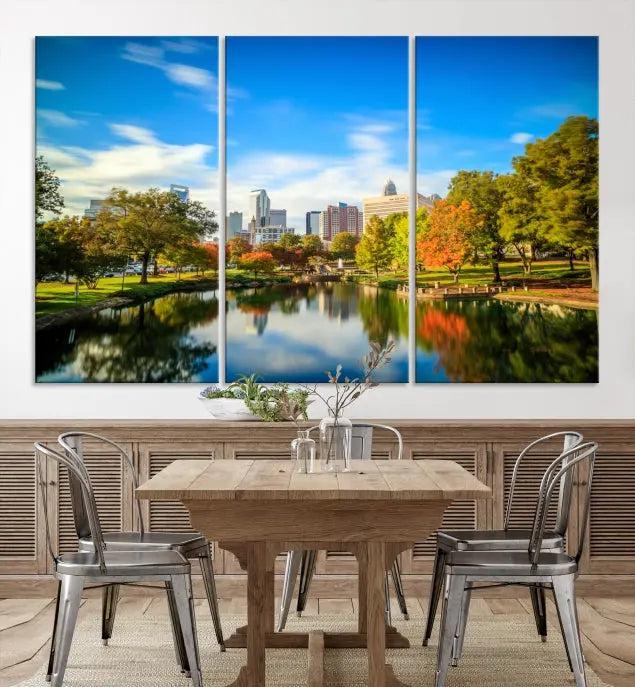 The Charlotte City Park at Spring Skyline Cityscape View Wall Art Canvas Print features a triptych of a city park scene with a calm lake, colorful autumn trees, and skyline. Crafted on museum-quality canvas and hand-assembled with a frame, this artwork is ready to hang and ideal for bringing elegance and serenity to your living space.