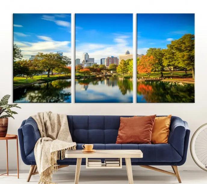 The Charlotte City Park at Spring Skyline Cityscape View Wall Art Canvas Print features a triptych of a city park scene with a calm lake, colorful autumn trees, and skyline. Crafted on museum-quality canvas and hand-assembled with a frame, this artwork is ready to hang and ideal for bringing elegance and serenity to your living space.