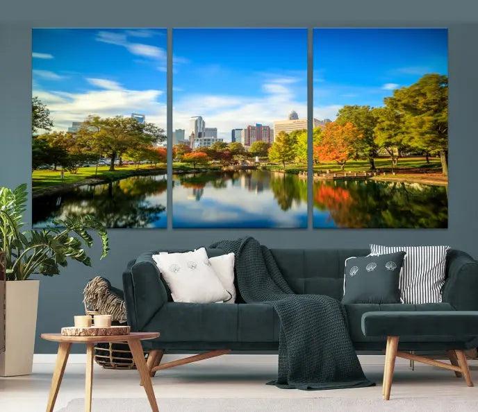 The Charlotte City Park at Spring Skyline Cityscape View Wall Art Canvas Print features a triptych of a city park scene with a calm lake, colorful autumn trees, and skyline. Crafted on museum-quality canvas and hand-assembled with a frame, this artwork is ready to hang and ideal for bringing elegance and serenity to your living space.