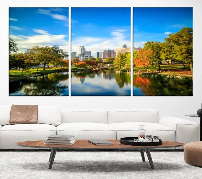 The Charlotte City Park at Spring Skyline Cityscape View Wall Art Canvas Print features a triptych of a city park scene with a calm lake, colorful autumn trees, and skyline. Crafted on museum-quality canvas and hand-assembled with a frame, this artwork is ready to hang and ideal for bringing elegance and serenity to your living space.