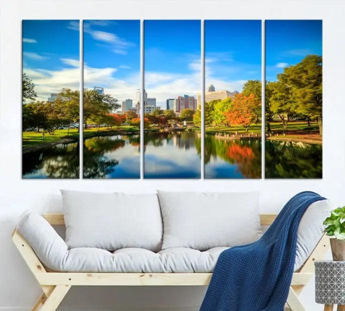 The Charlotte City Park at Spring Skyline Cityscape View Wall Art Canvas Print features a triptych of a city park scene with a calm lake, colorful autumn trees, and skyline. Crafted on museum-quality canvas and hand-assembled with a frame, this artwork is ready to hang and ideal for bringing elegance and serenity to your living space.