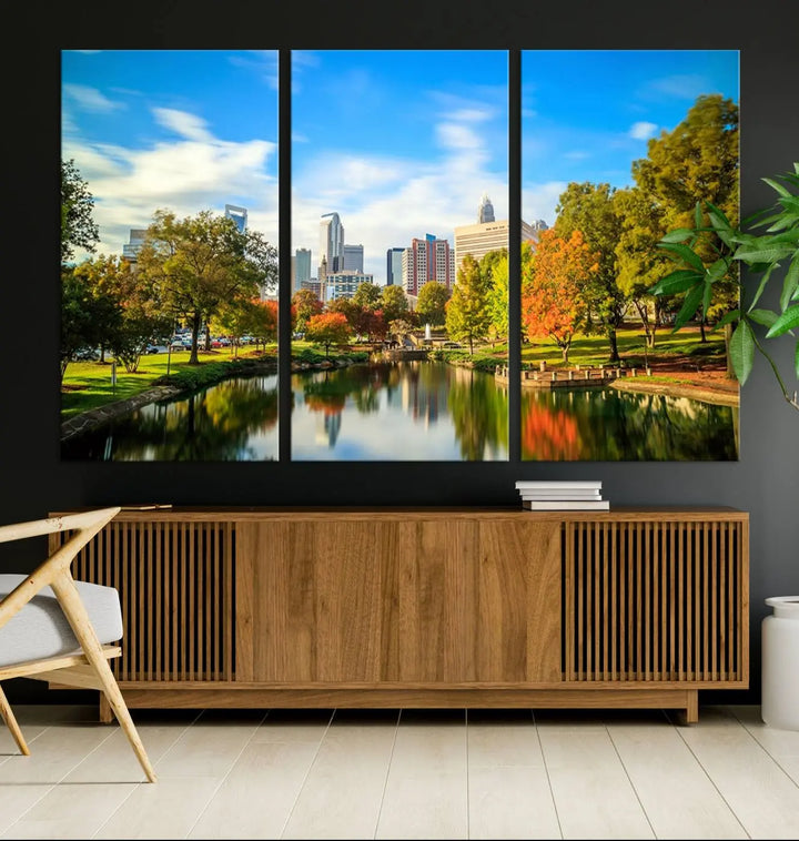 The Charlotte City Park at Spring Skyline Cityscape View wall art canvas print is a triptych featuring a scenic park with a lake and city skyline. It is gallery-wrapped on museum-quality canvases.