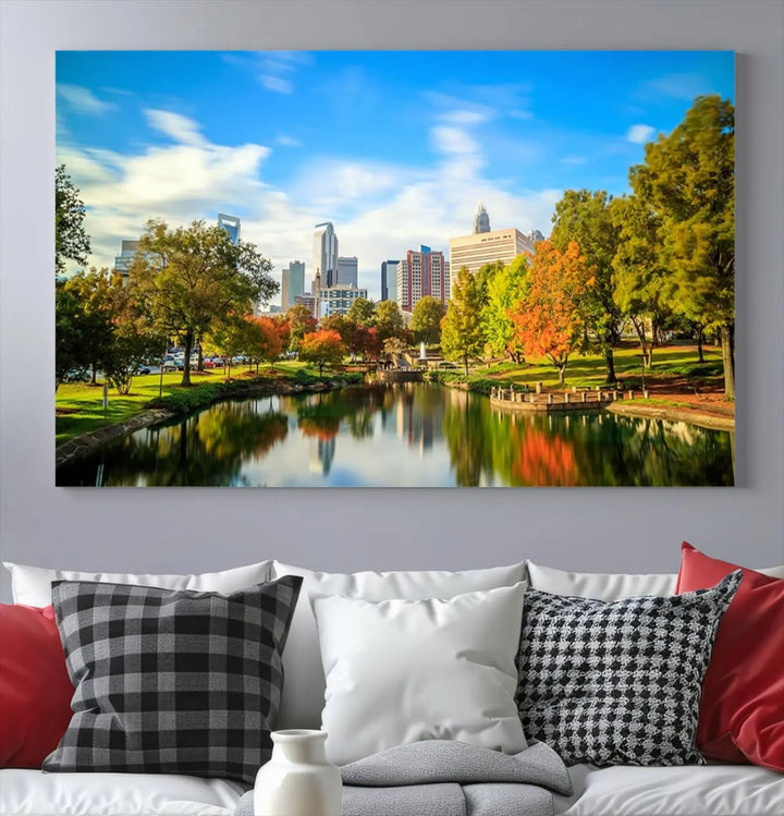 The Charlotte City Park at Spring Skyline Cityscape View wall art canvas print is a triptych featuring a scenic park with a lake and city skyline. It is gallery-wrapped on museum-quality canvases.