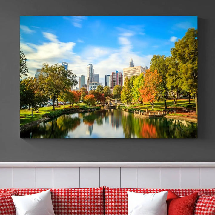 The Charlotte City Park at Spring Skyline Cityscape View wall art canvas print is a triptych featuring a scenic park with a lake and city skyline. It is gallery-wrapped on museum-quality canvases.