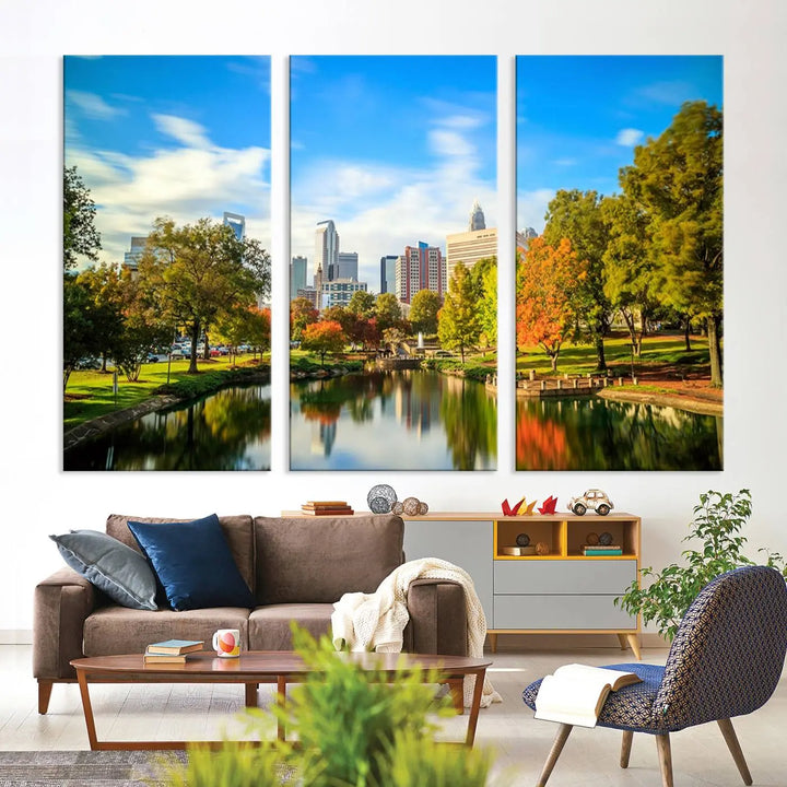 The Charlotte City Park at Spring Skyline Cityscape View wall art canvas print is a triptych featuring a scenic park with a lake and city skyline. It is gallery-wrapped on museum-quality canvases.