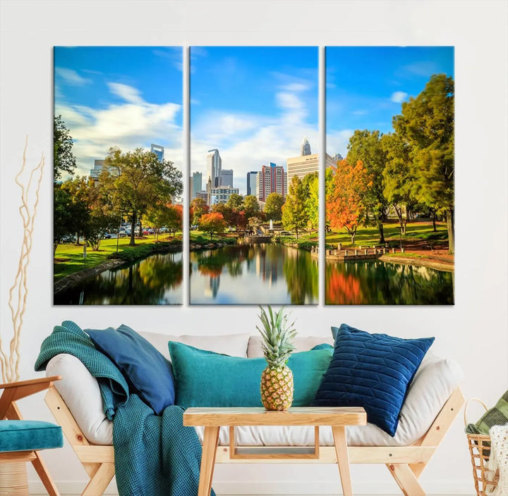 The Charlotte City Park at Spring Skyline Cityscape View wall art canvas print is a triptych featuring a scenic park with a lake and city skyline. It is gallery-wrapped on museum-quality canvases.